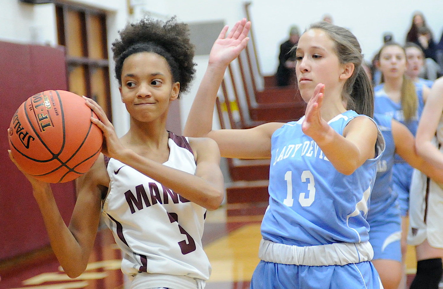 Eyes on the sidelines. Manor’ Nevaeha Jones, a senior guard, posted 8 points. She is pictured with Roscoe’s Athena Niforatos, a junior guard.